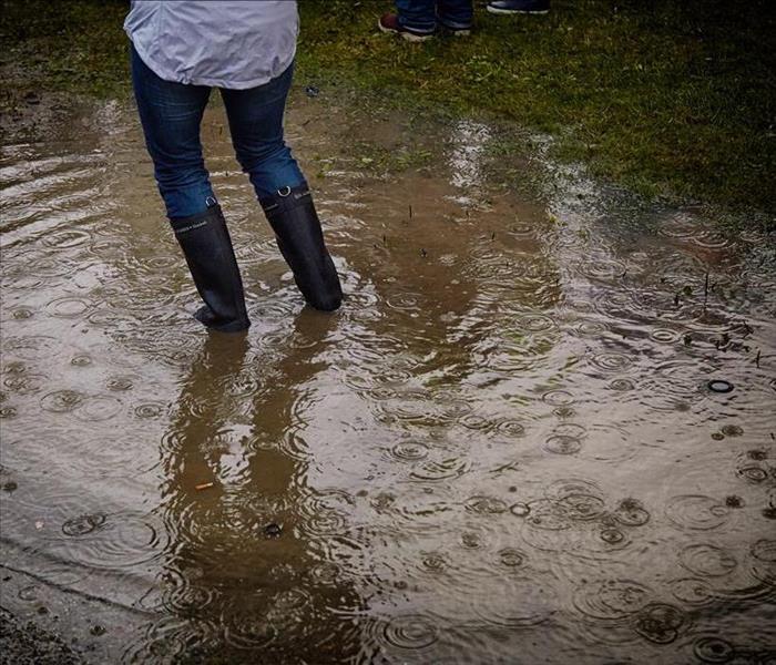 Person standing in large puddle